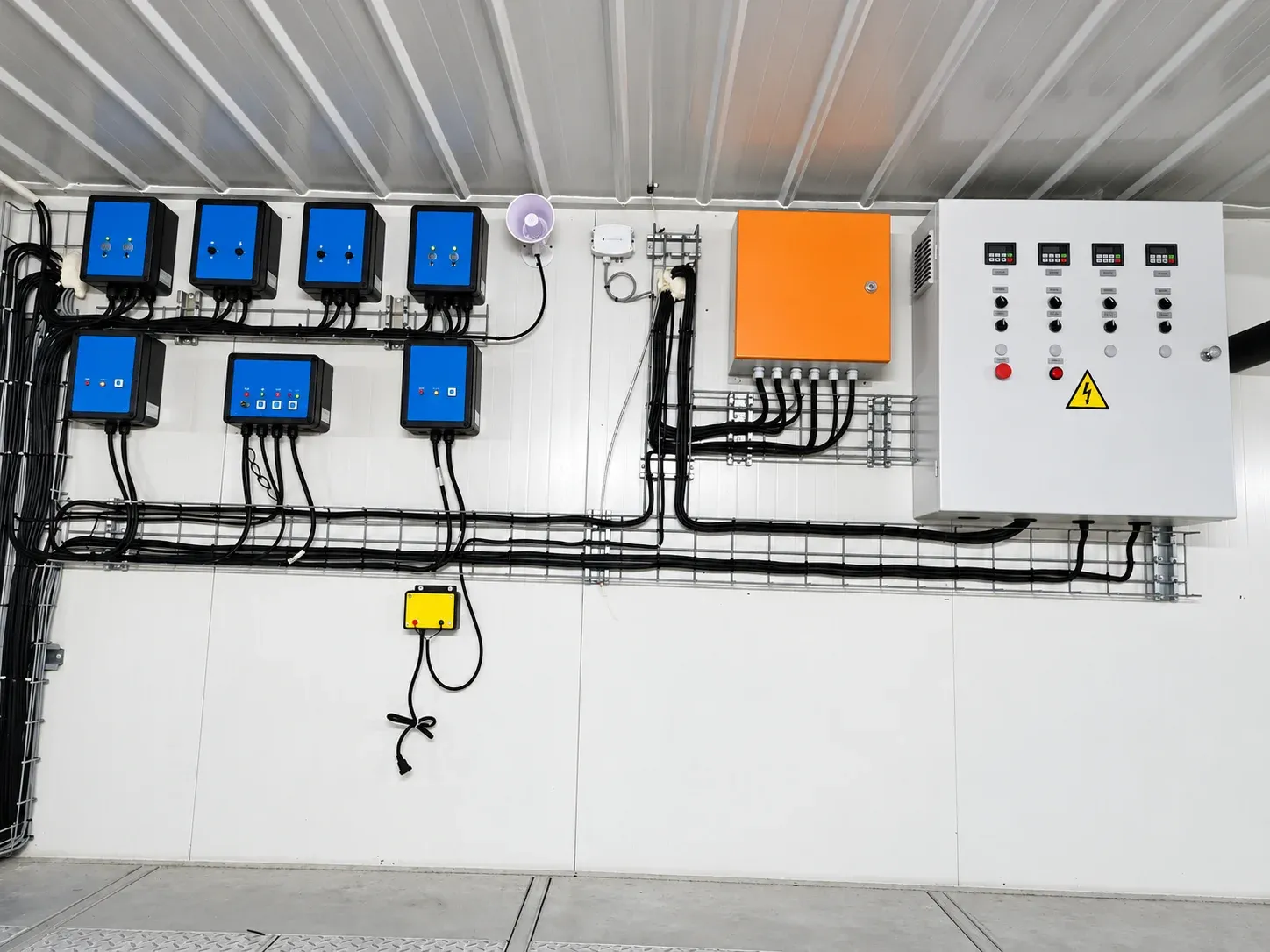 Equipment controllers installed in a poultry house